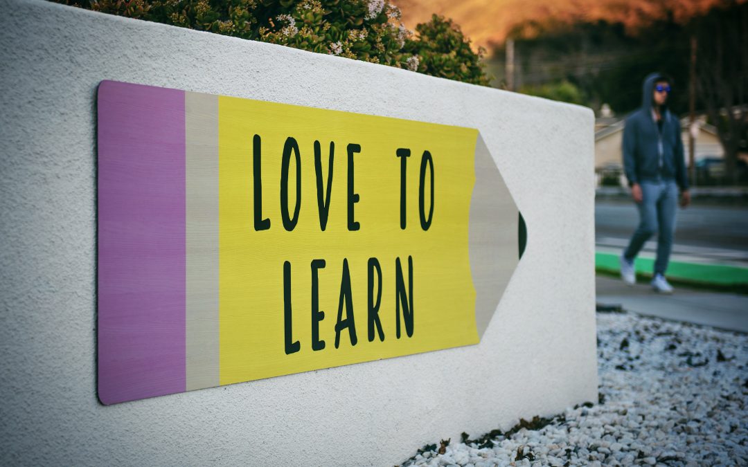 Wall sign that says love to learn